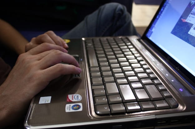 Photo of a user using a Windows laptop computer