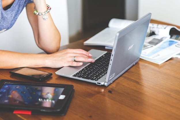 Foot of a girl using a laptop