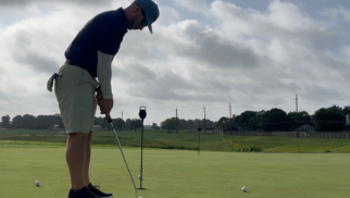 Golfer Geek setting up to putt